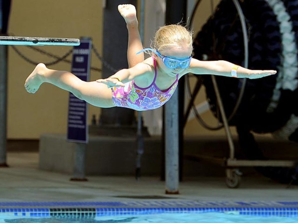 child belly flop off diving board e1683746108785
