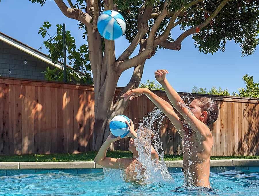 kids shooting basketball in the pool